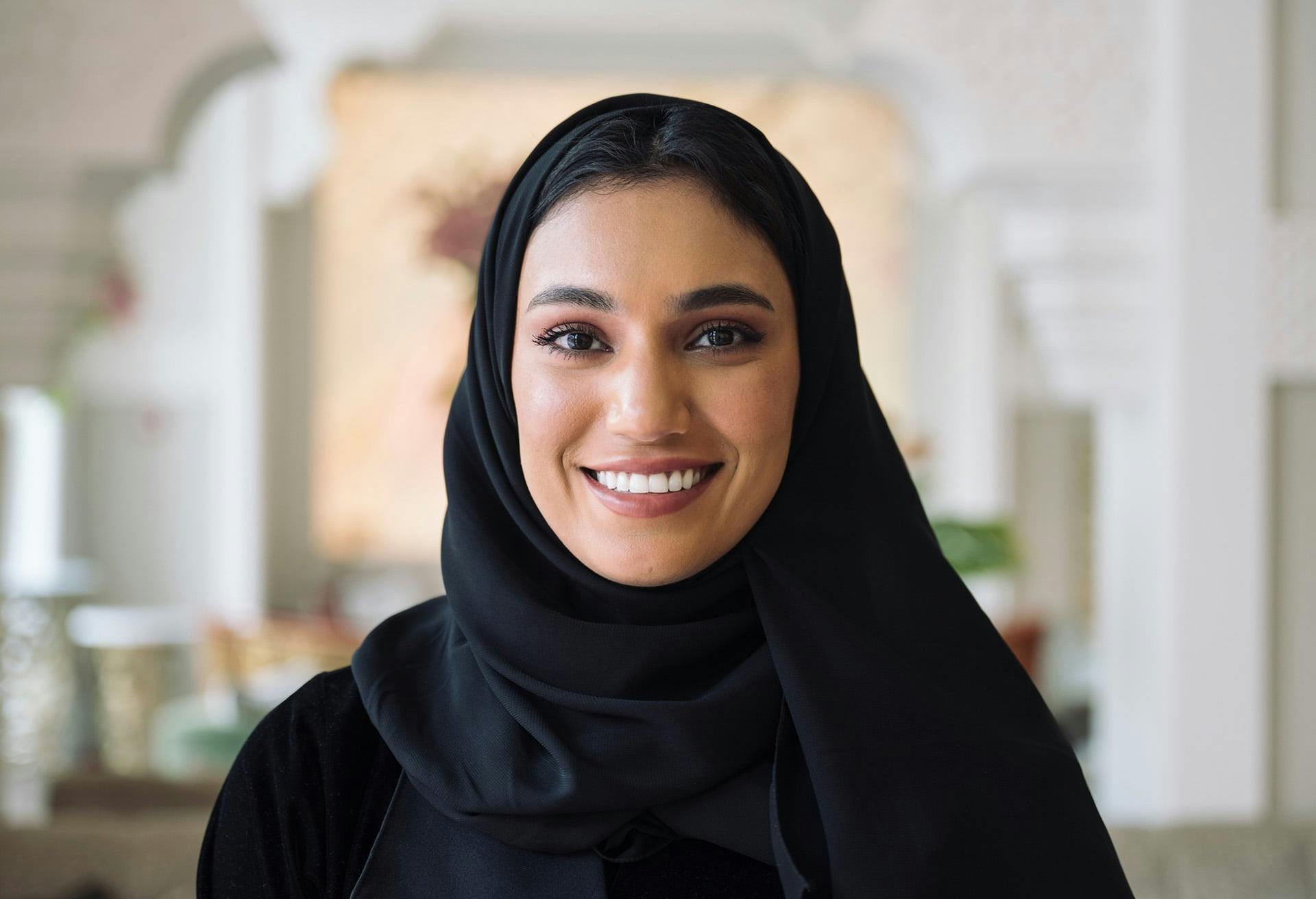 Woman wearing headscarf smiling